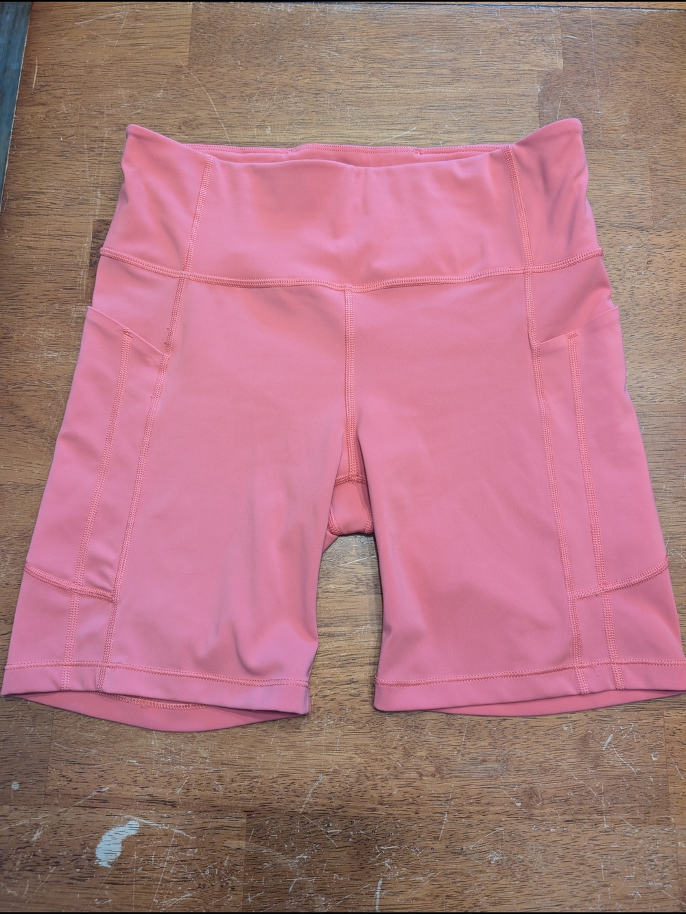 Athleta Ultimate Stash 7" Coral Pink High-Rise Bike Shorts